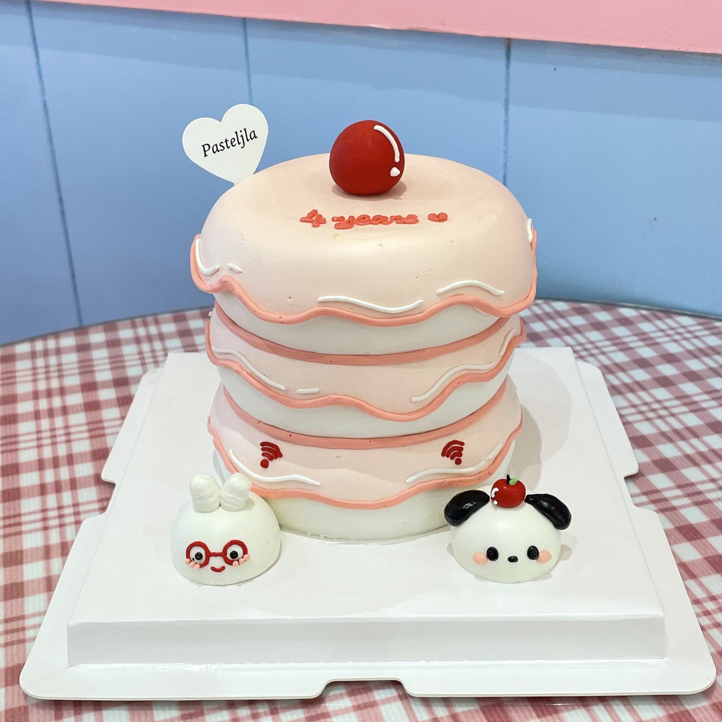 Pink and white couple cake