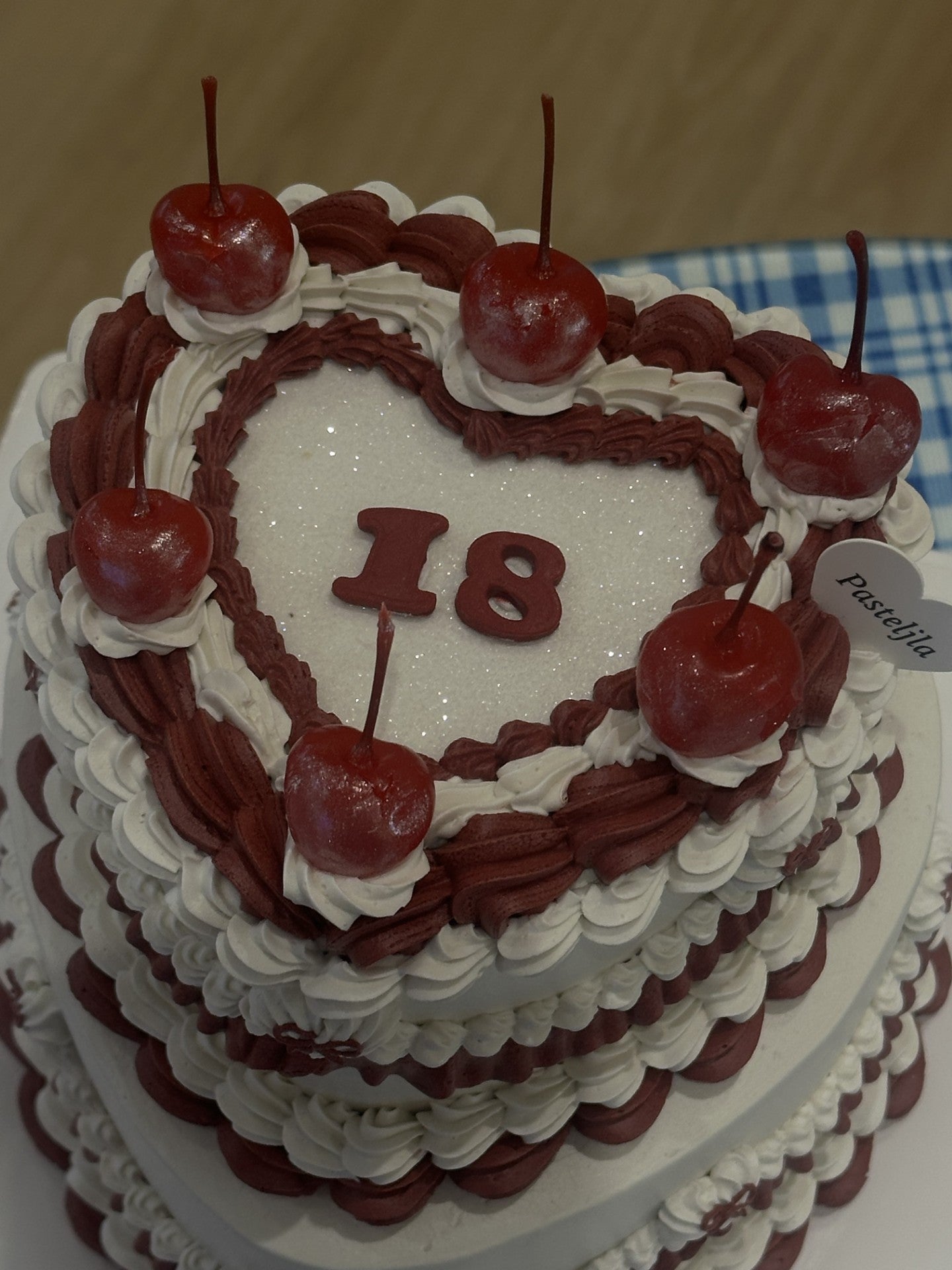 Two tier red and white glitter cake