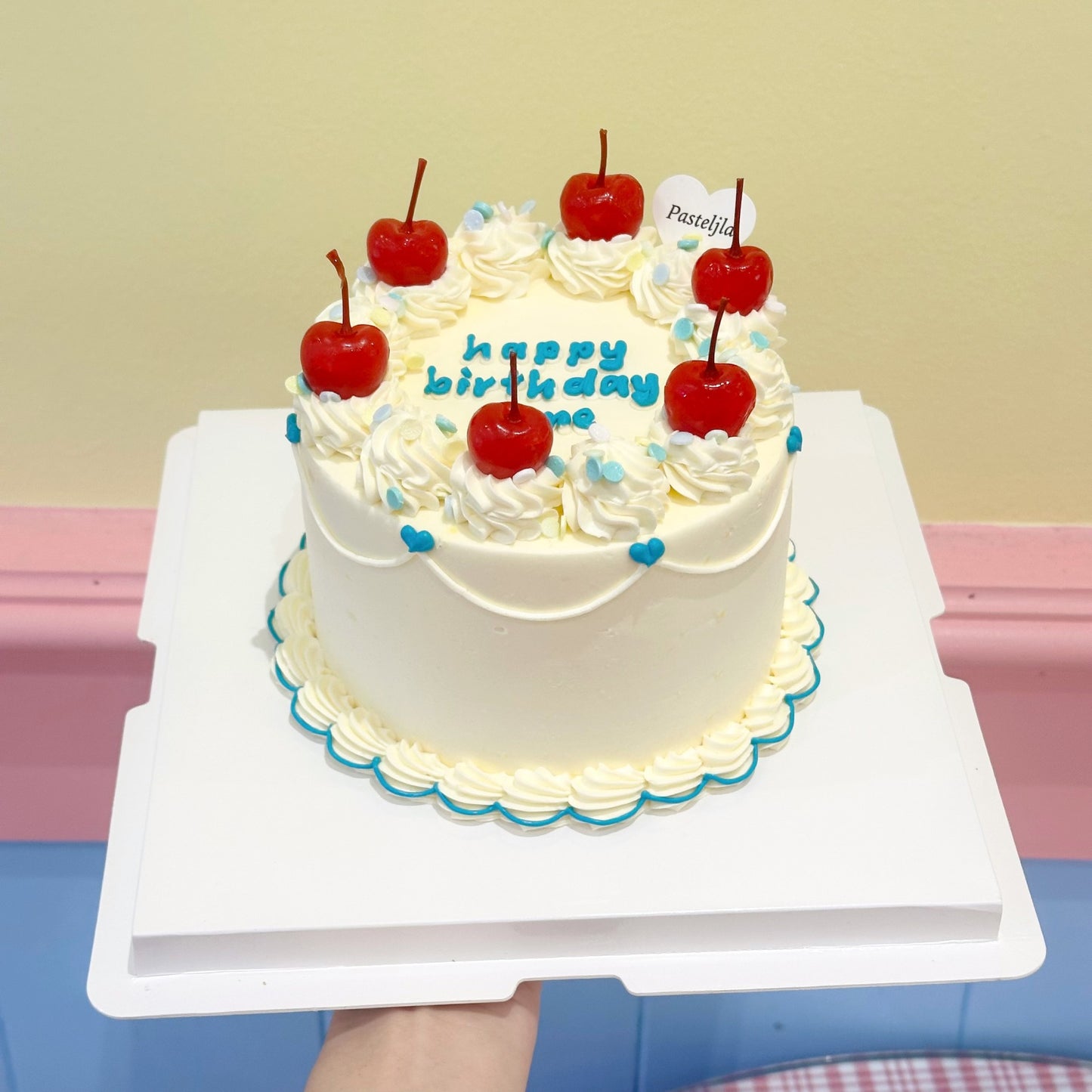 Playful blue and white cherry cake