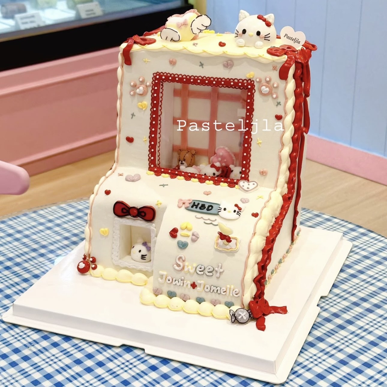 Hello kitty claw machine cake