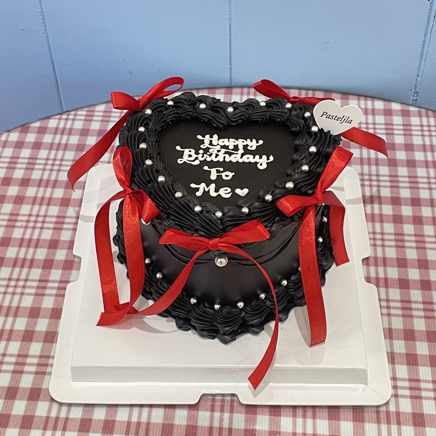 Black red heart shape coquette cake