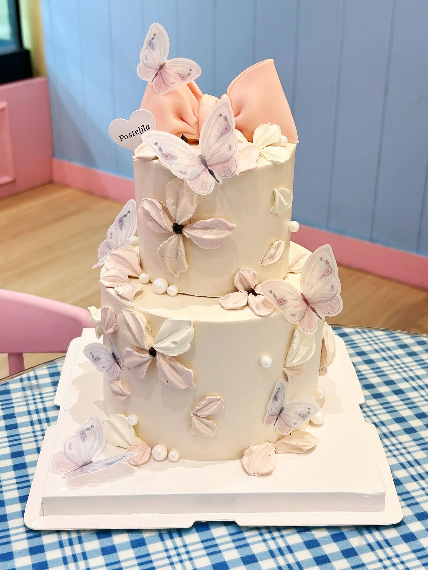Two tier pink butterfly cake