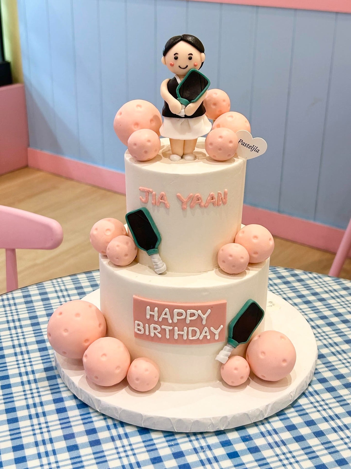 Two tier pickle ball girl cake