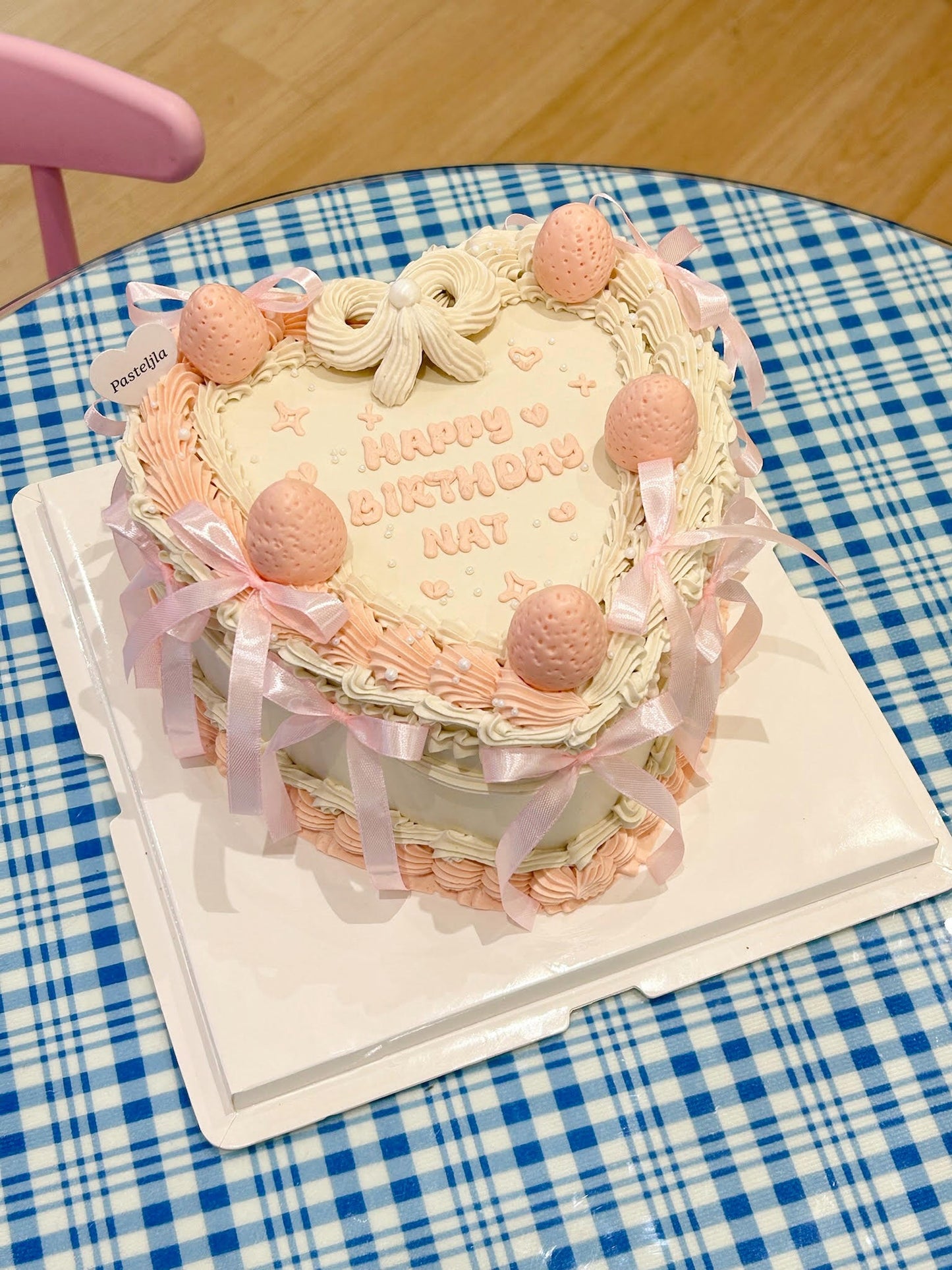 Pink and white strawberry heart shape cake