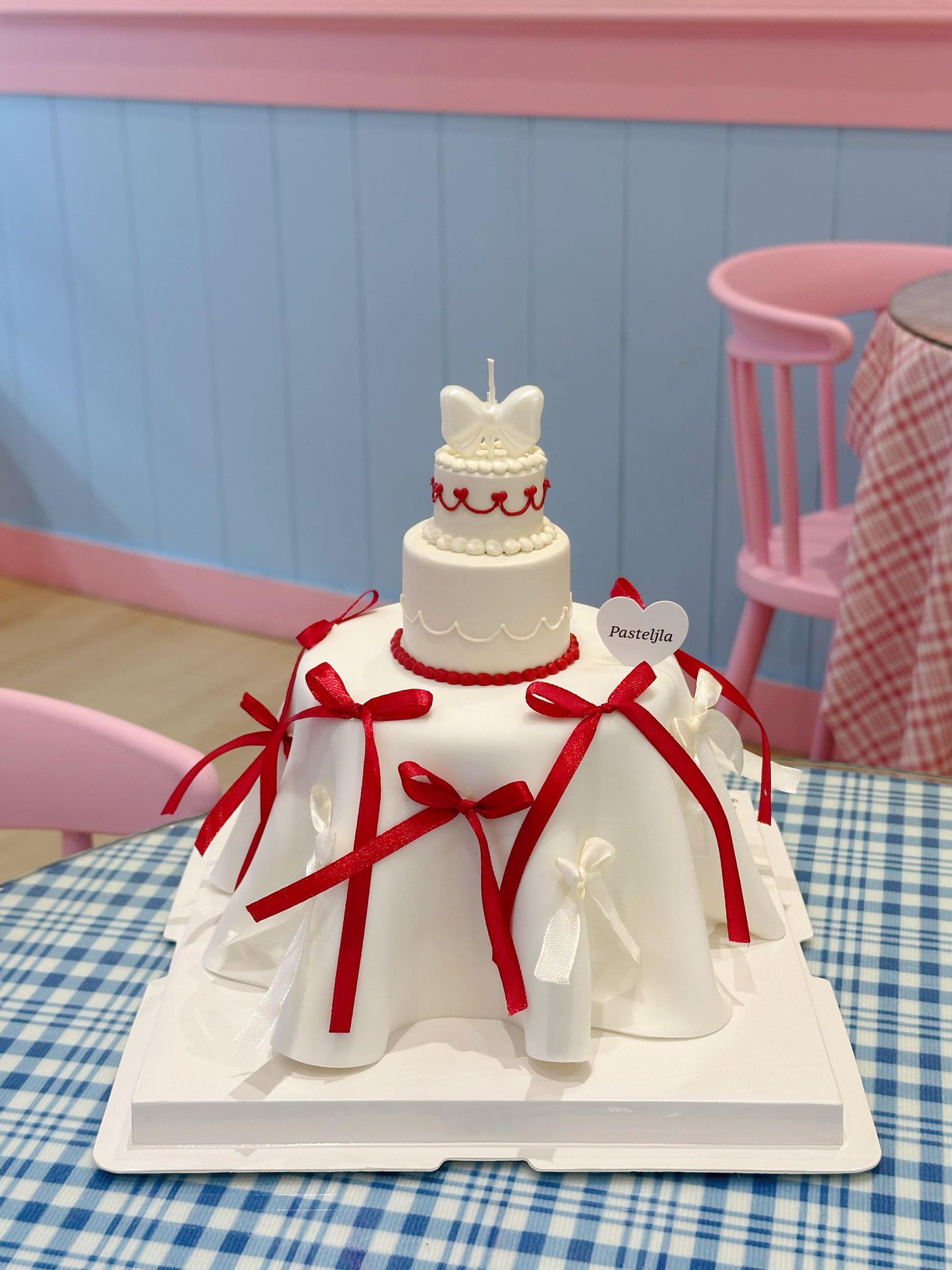 Mini three tier red white coquette cake