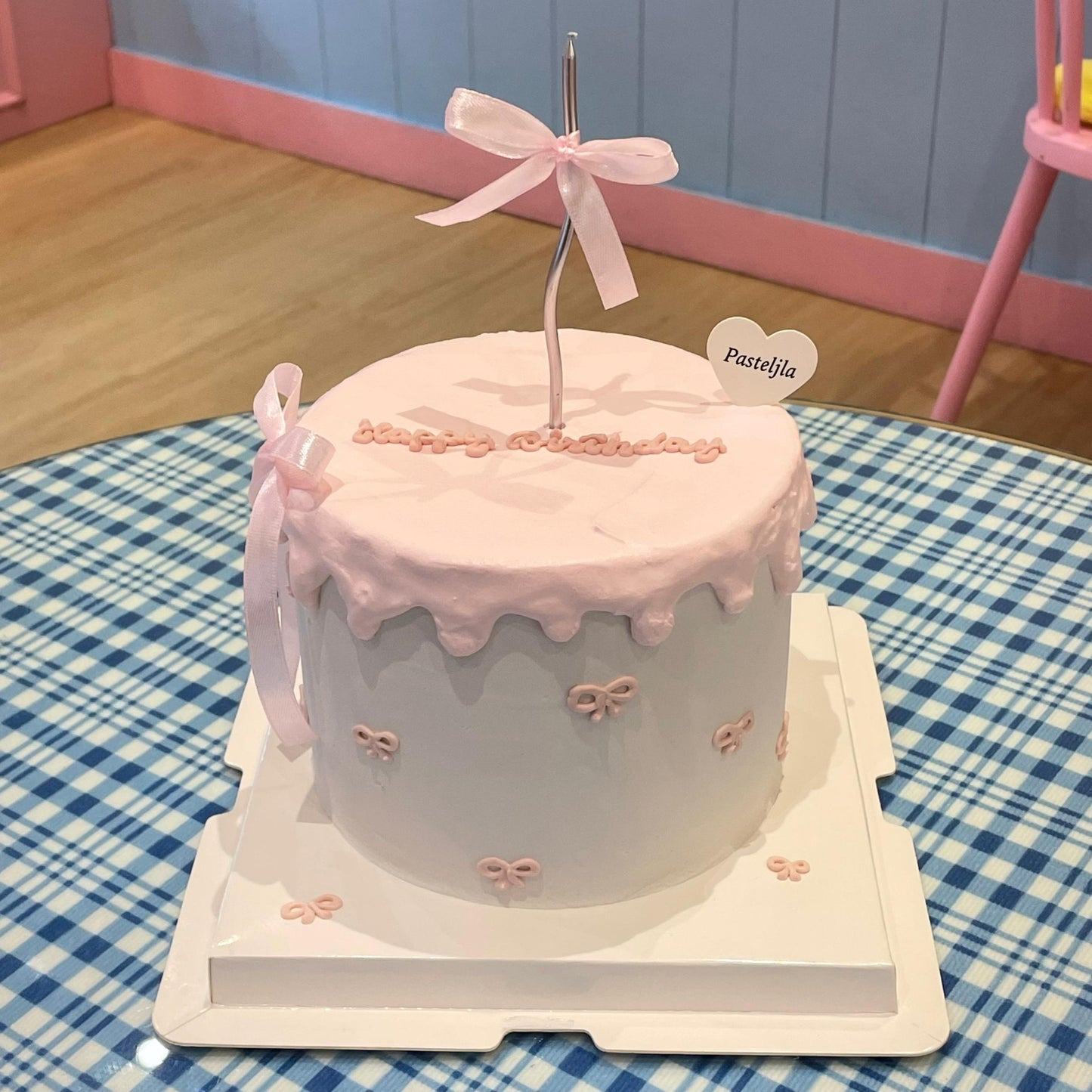 Minimalist pink ribbon cake