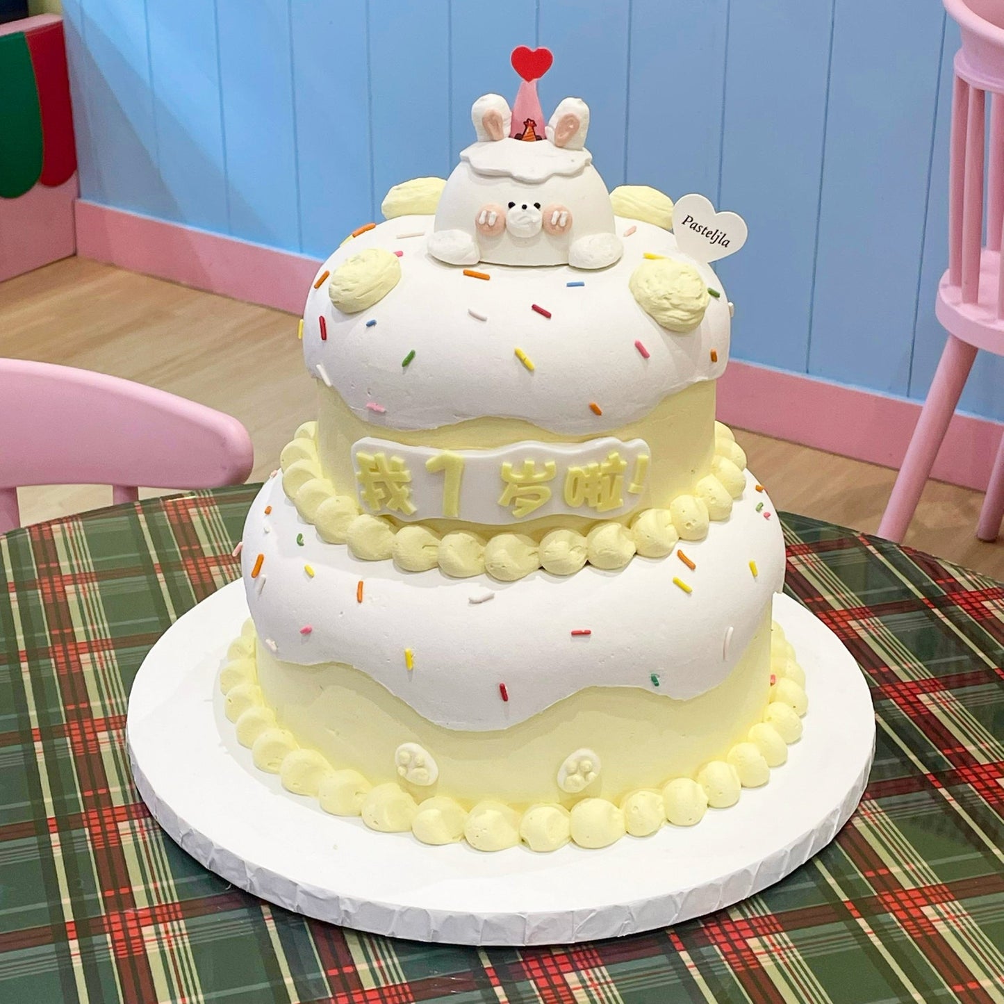 Two tier yellow theme bunny cake