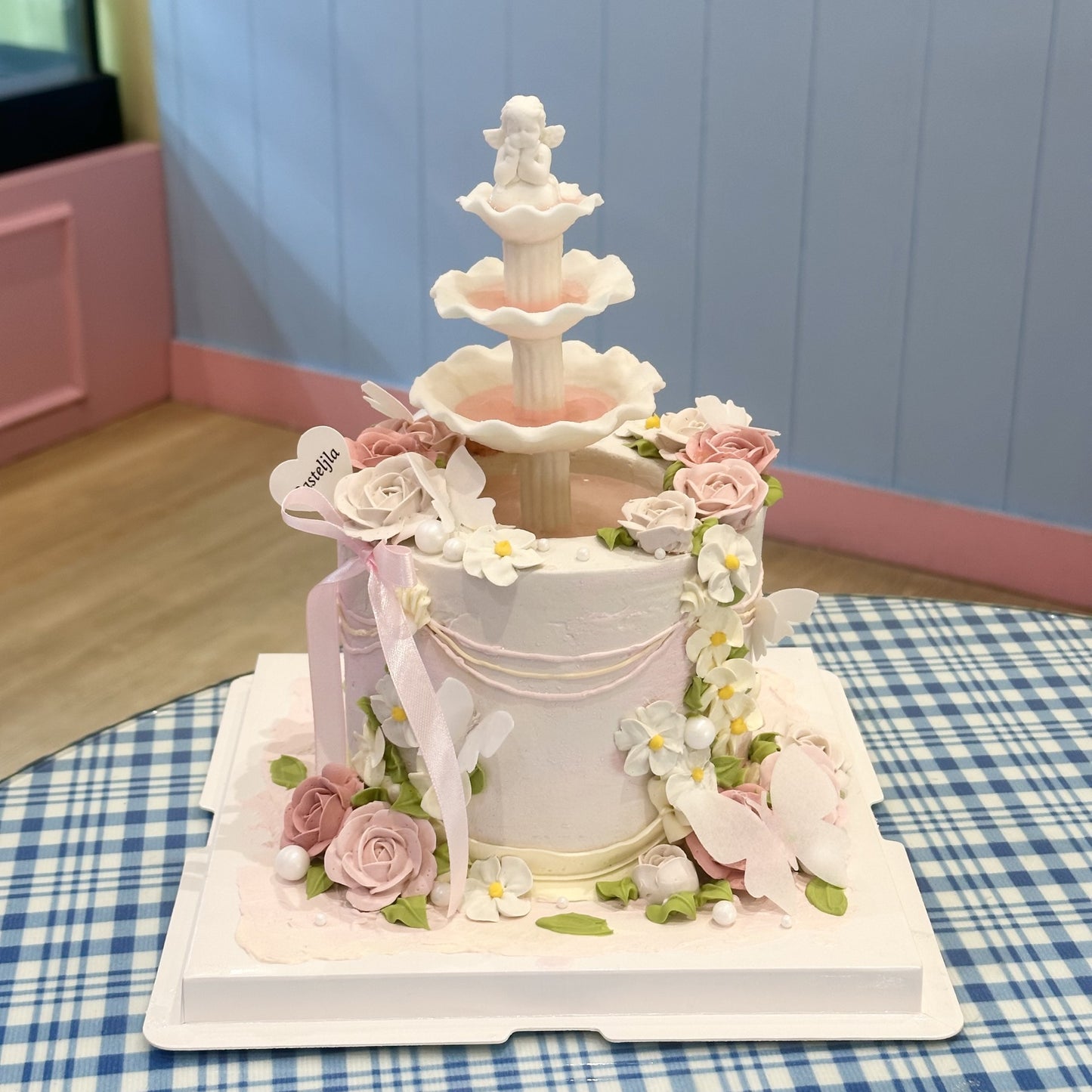 Pink floral wishing fountain cake