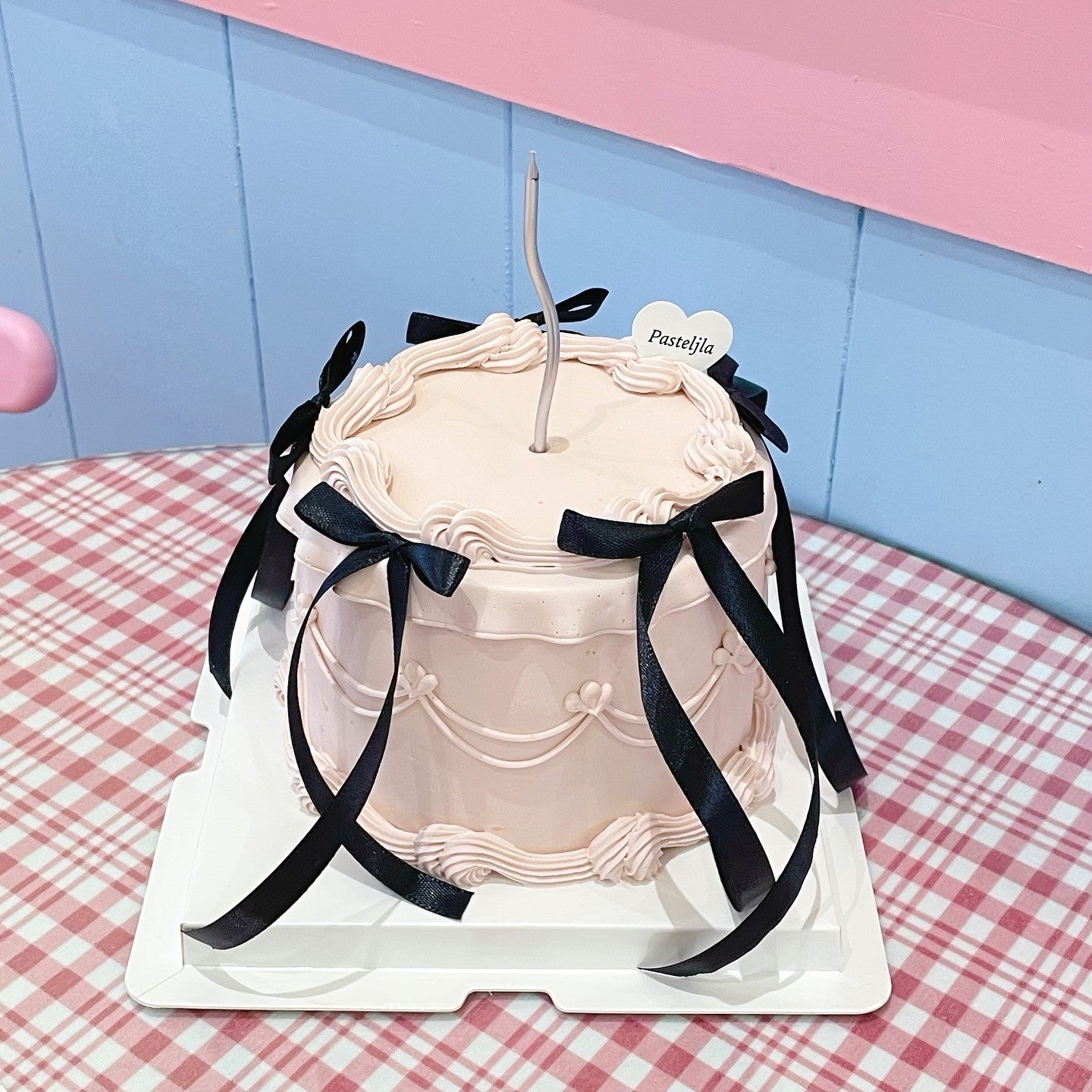 Pink and black coquette cake