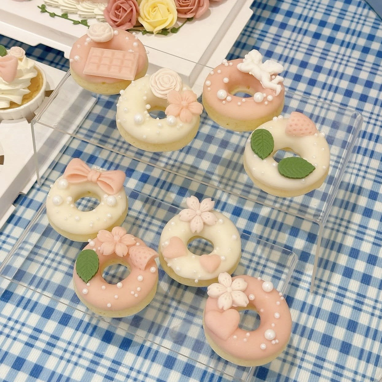 Pink and white floral theme doughnuts 