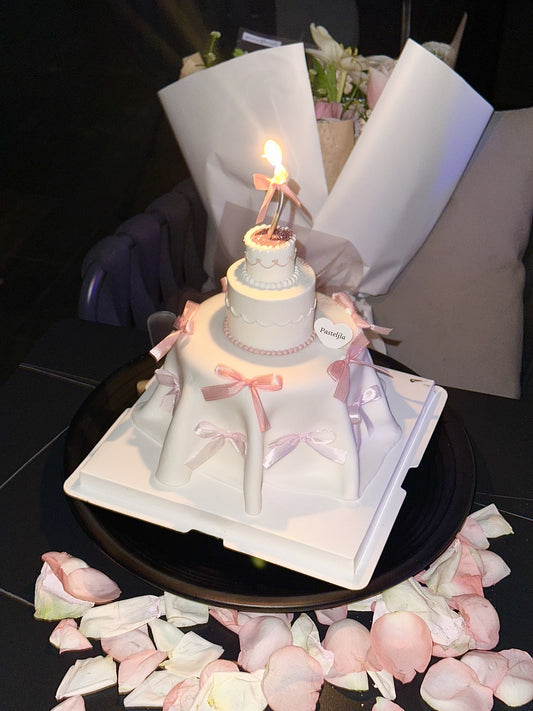 Mini three tier pink white coquette cake 