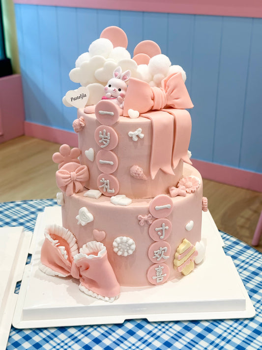 Two tier pink rabbit baby cake