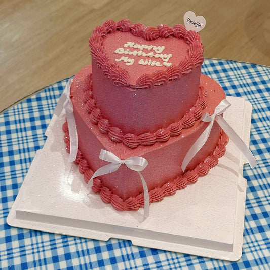 Two tier pink glitter cake 