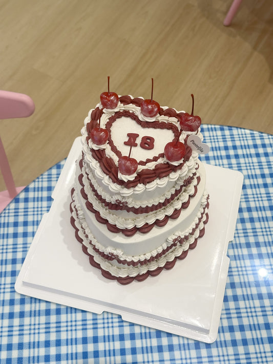 Two tier red and white glitter cake