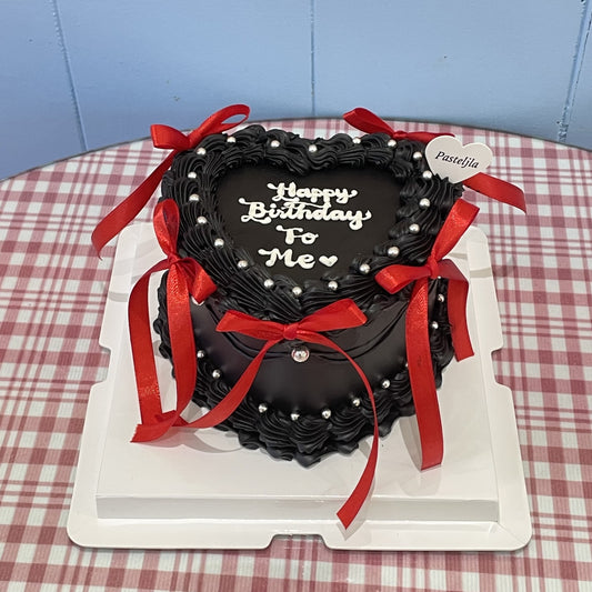 Black red heart shape coquette cake