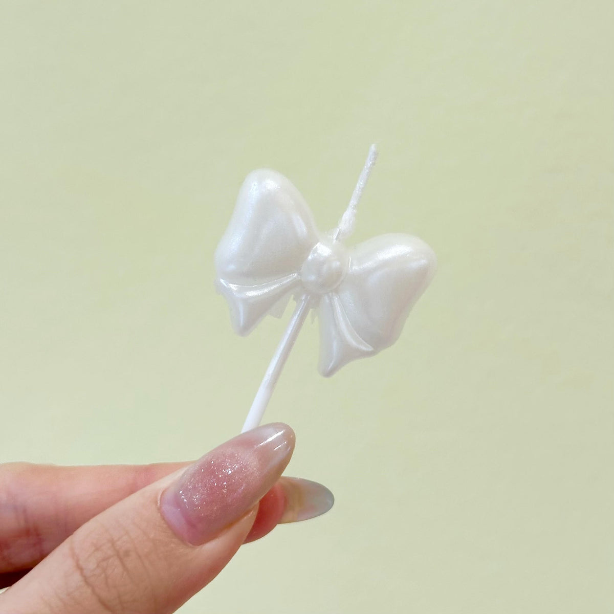 White ribbon candle