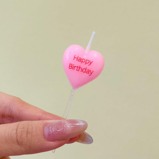Pink heart shape happy birthday candle