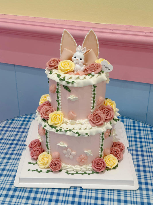 Two tier pink bunny cake