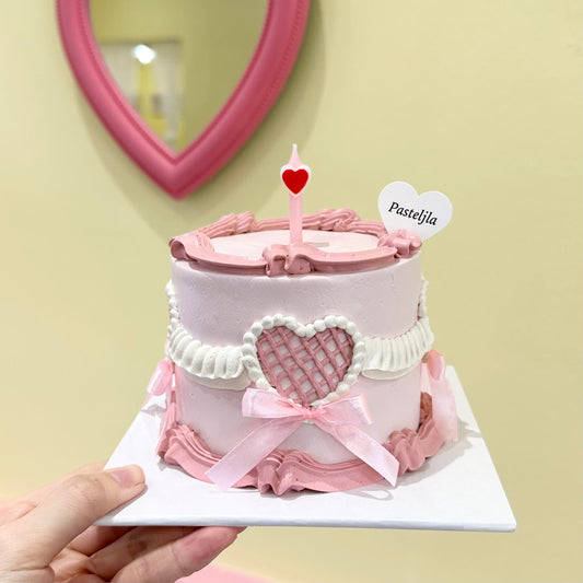 Sweet pink heart shape coquette cake