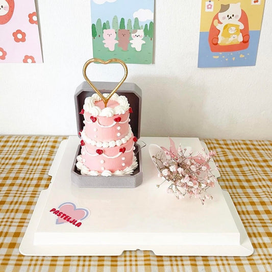 Two Tier Pink Cake with Pink Baby Breath Bouquet